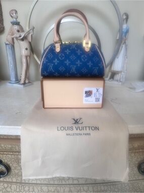 Lux inspired Nano Speedy bag is blue monogram denim.